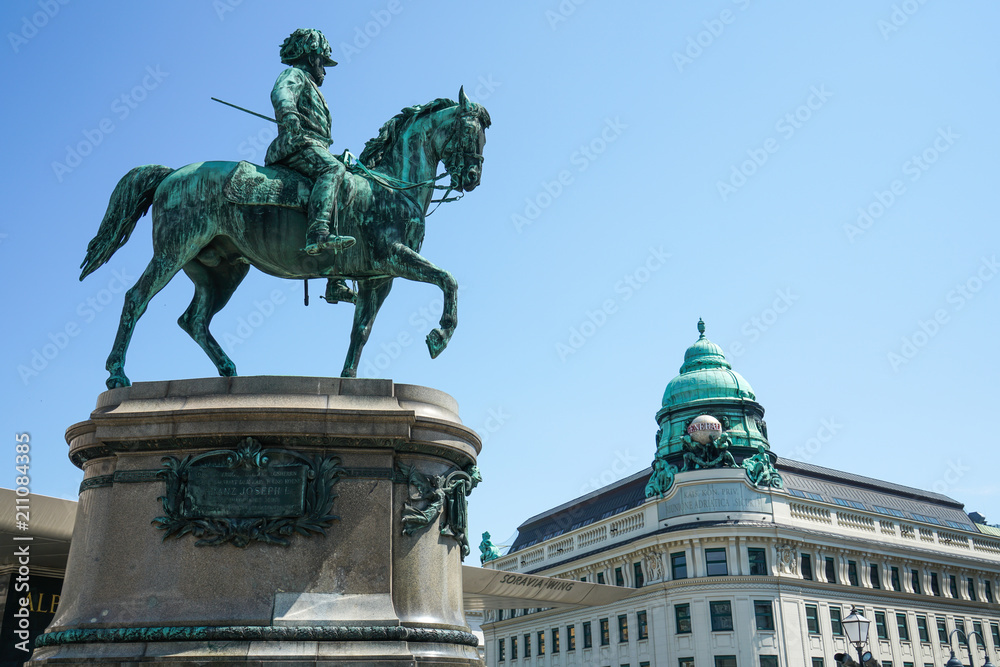 Front view of the Albertina building. Franz Joseph I monument near Albertina Museum, Vienna.