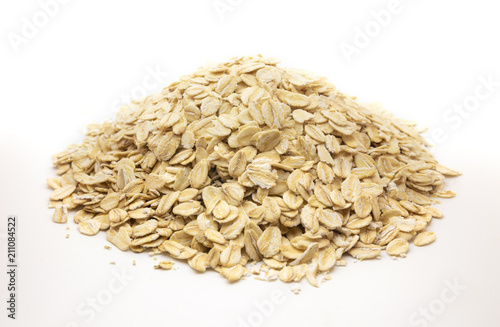 pile of rolled oats on white background
