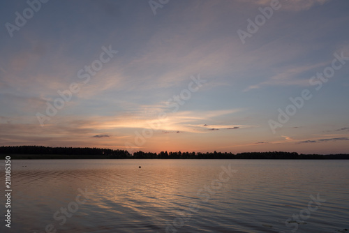 Sunrise over lake in finland photo