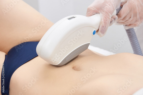 Laser hair removal. Medical procedure. Hair removal on the body. Bright skin.