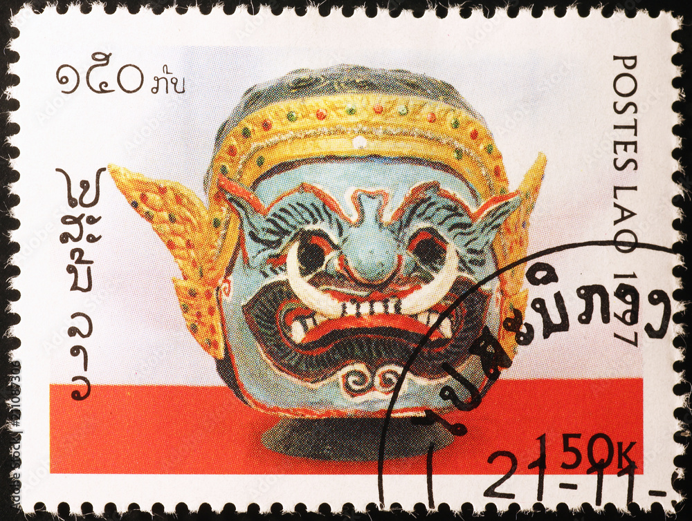 Mask of a demon on laotian postage stamp