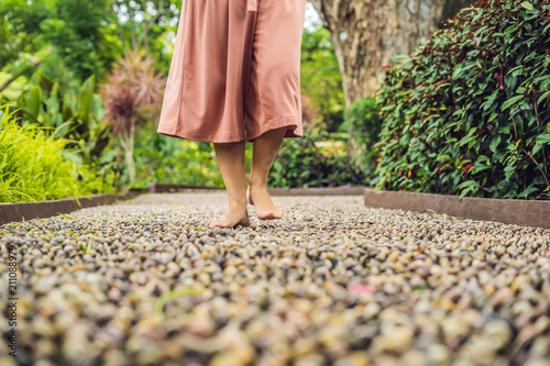 Bilde på lerret Woman Walking On A Textured Cobble Pavement, Reflexology