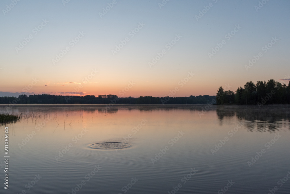 Sunrise at early morning, calm lake and water movement Sunrise at early morning, calm lake and water movement
