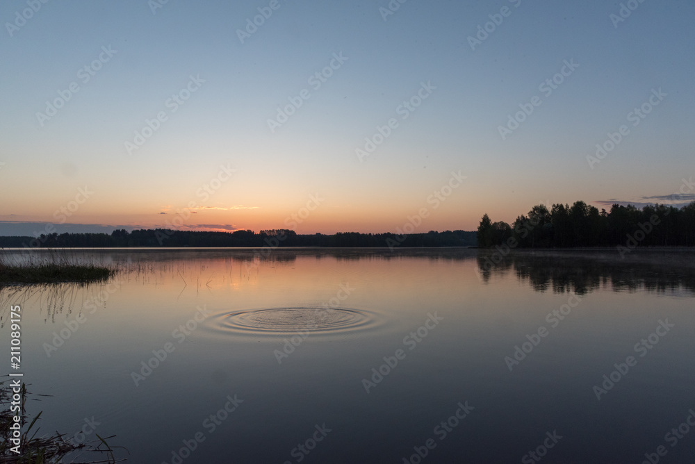 Sunrise at early morning, calm lake and water movement
