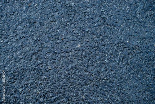 Texture of wet asphalt road. Sidewalk background after heavy rai