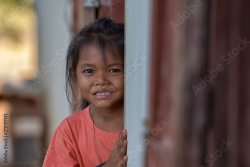 Fotografie Smiling faces of young children or young people from rural Asia.