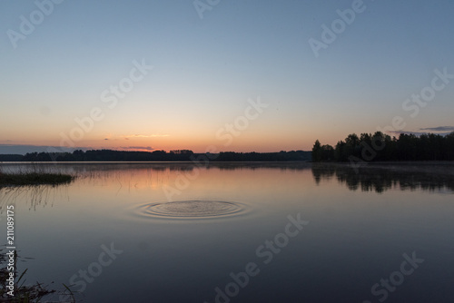 Sunrise at early morning, calm lake and water movement