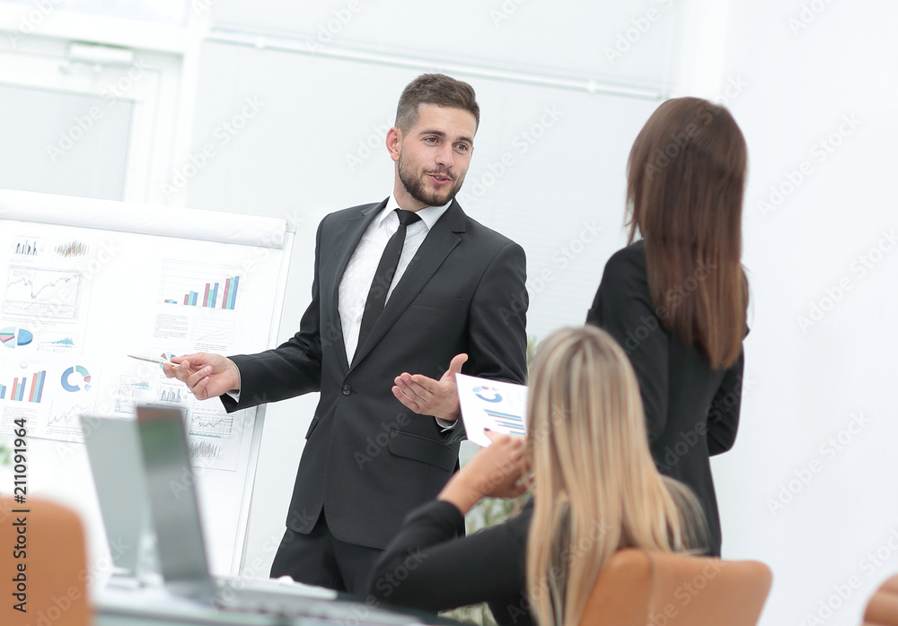 businessman makes a presentation to his business team businessman makes a presentation to his business team