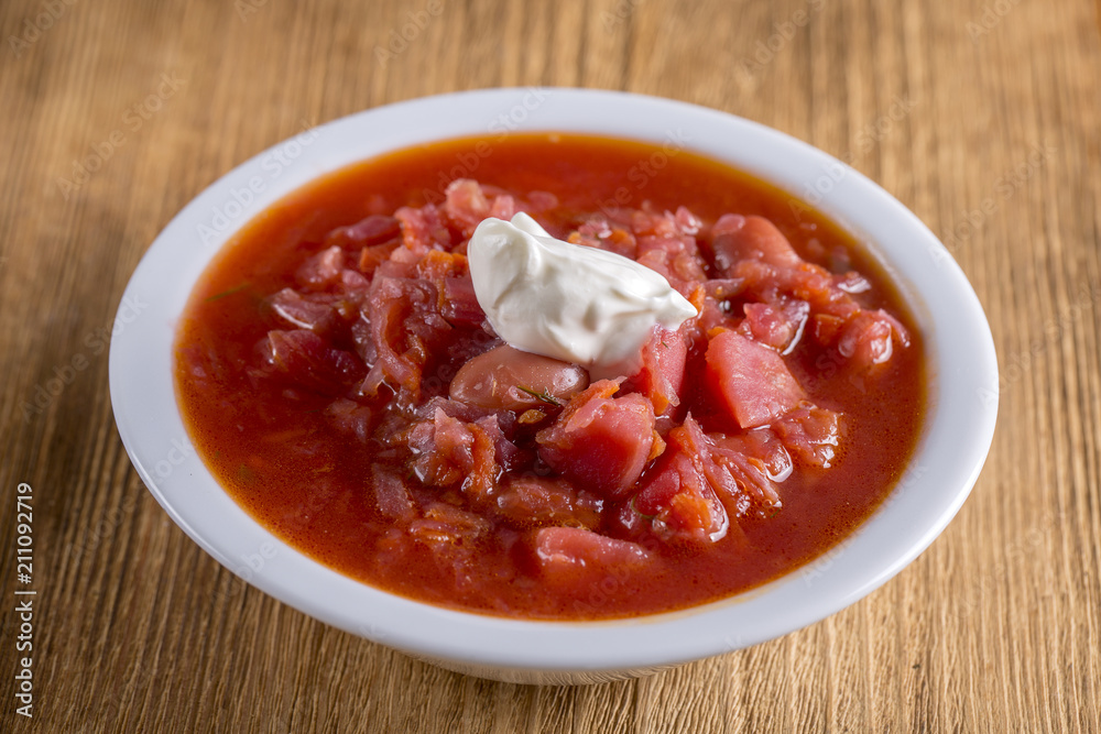 Vegetable soup - red borsch, closeup. Healthy beetroot soup, vegetarian food. Ukrainian and russian national food - red beet soup, borscht