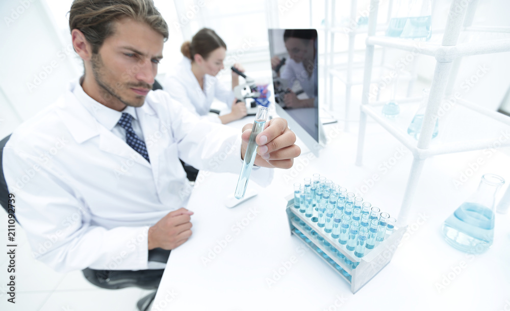Busy group of researchers carrying out experiments Busy group of researchers carrying out experiments