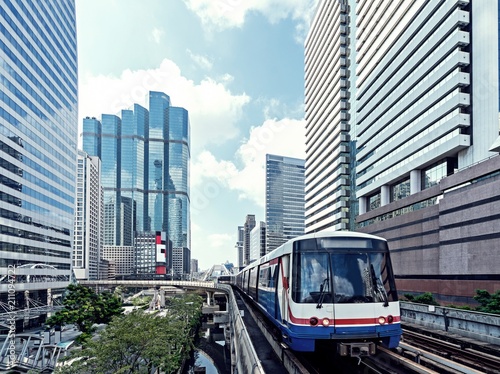 Buildings with Sky train in the city of Bangkok. City transportation concept.