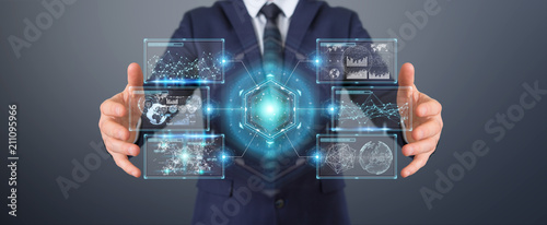 Businessman using digital screens interface with holograms datas 3D rendering