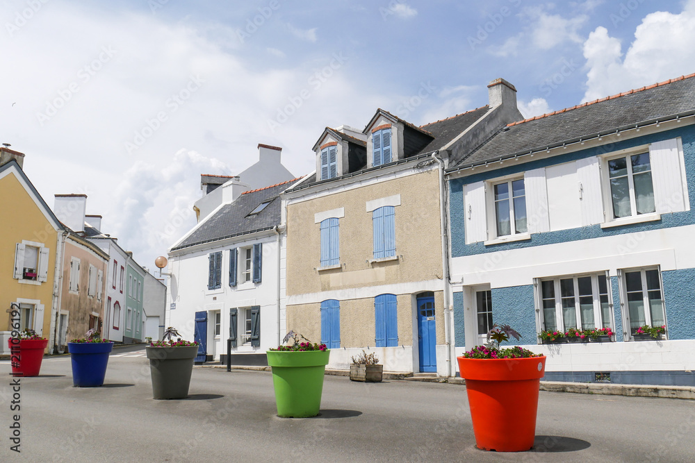 Central square of a typical brittany village with giant colored flower pots with nobody, Locmaria at Belle Ile en mer, Morbihan, France Central square of a typical brittany village with giant colored flower pots with nobody, Locmaria at Belle Ile en mer, Morbihan, France
