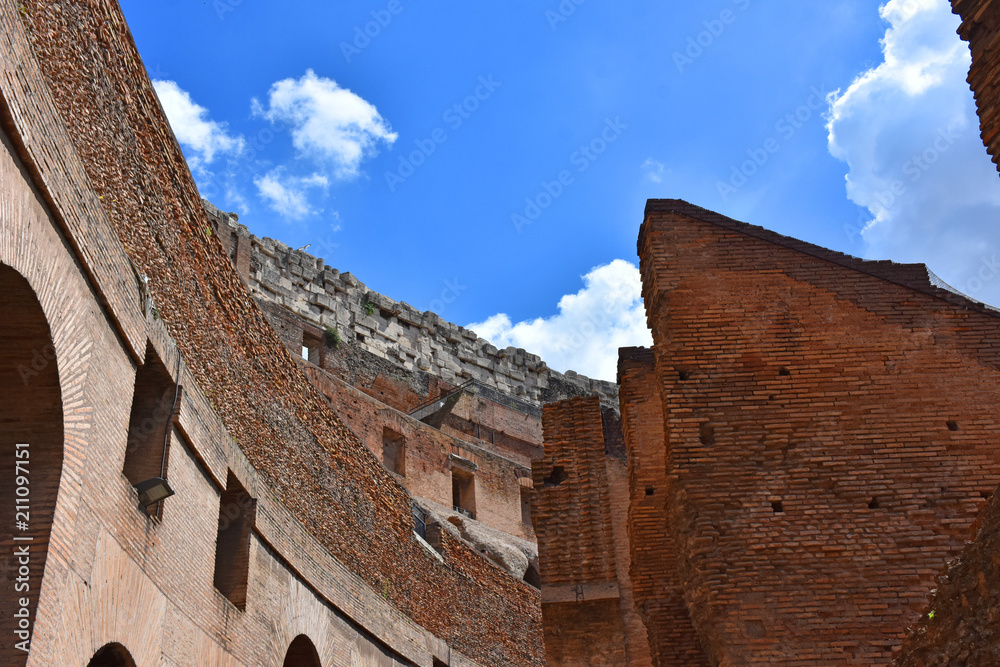 Italy, Rome, Colosseum. View of internal and external architectures. Known as the Flavian Amphitheater, it is the largest amphitheater in the world, located in the city center of Rome.