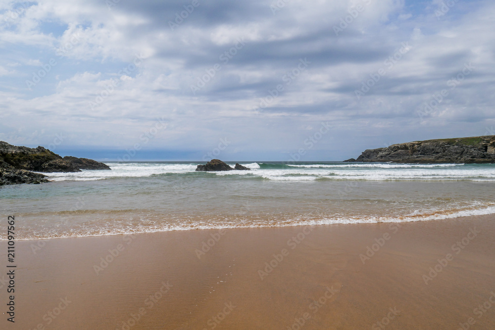 Lonely beach at Belle-Ile-en-Mer with cloudy sky, Brittany, France