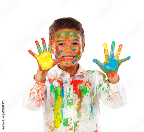 Funny boy with hands and face full of paint