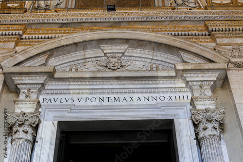 Closeup arch and columns of saint Peter basilica in Rome, Italy. Concept of catholic church interior and ancient landmarks and sightseeing. photo