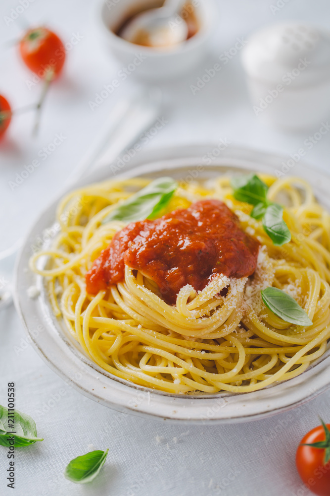 Pasta dish with tomato sauce on white plate Pasta dish with tomato sauce on white plate