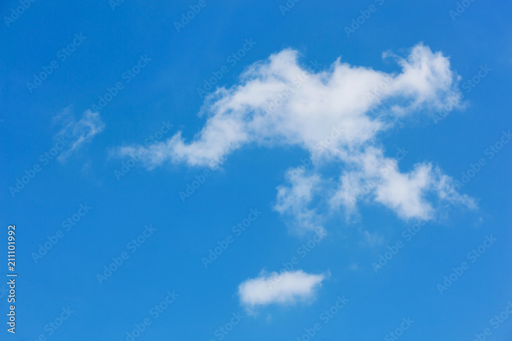 a large white cloud of interesting shape on a blue sky. natural background a large white cloud of interesting shape on a blue sky. natural background