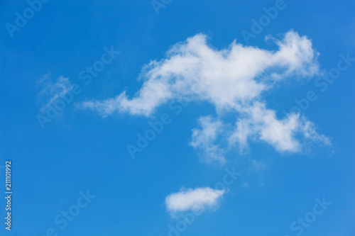 a large white cloud of interesting shape on a blue sky. natural background