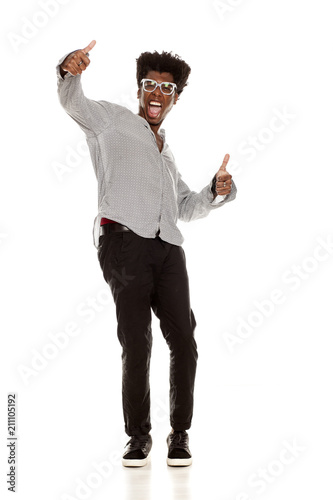 young exited handsome afro american guy stylish hipster standing isolated on white background with thumbs up. people lifestyle concept