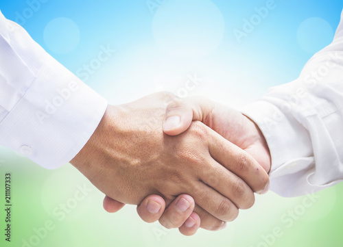 International Co-operative Day Concept: Business Persons Handshake Together Peacefully