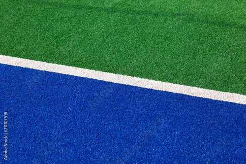 Synthetic hockey field sideline blue and green for background use