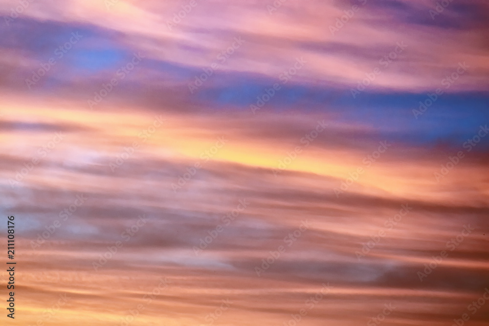 Blurred background. Bright sky with fluffy clouds.