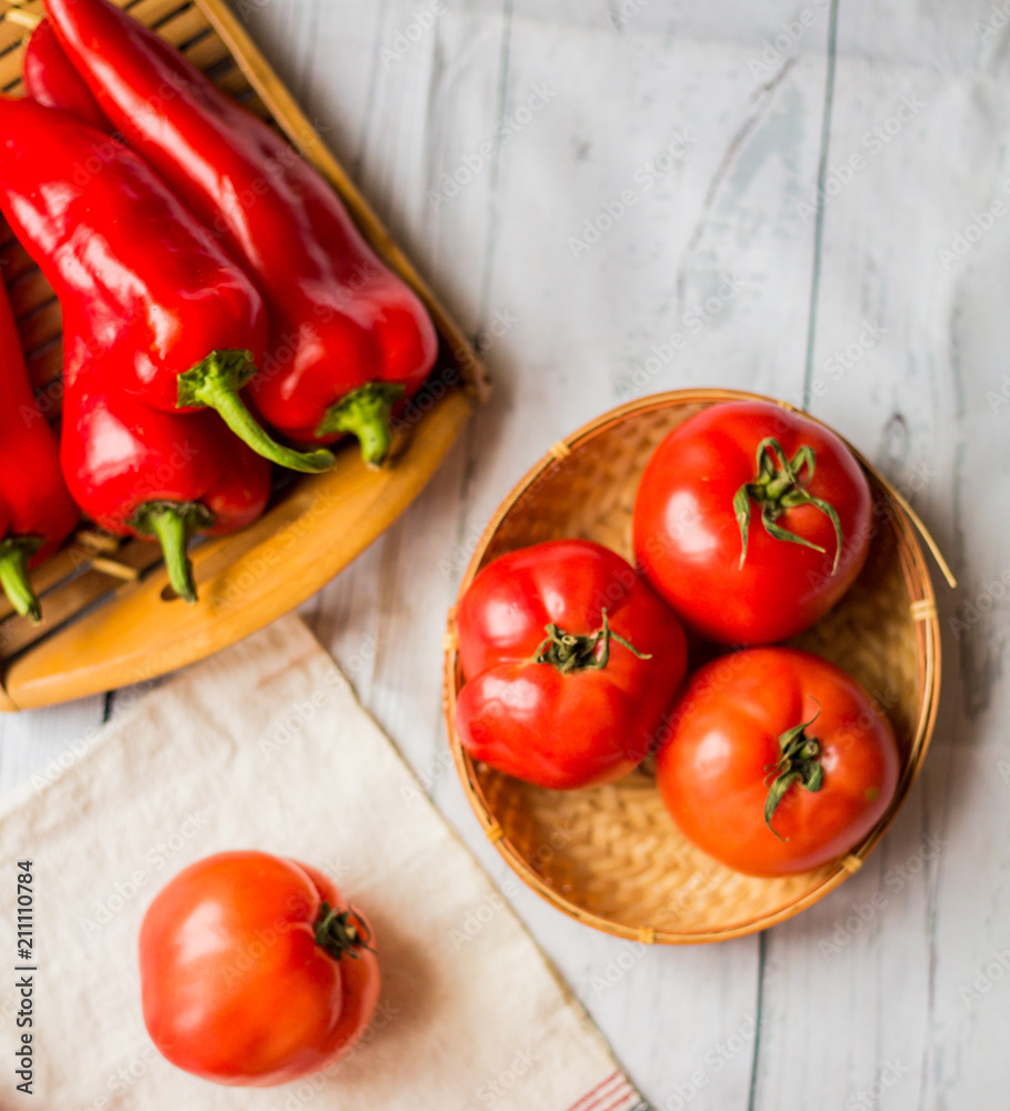 Close-up of fresh, ripe tomatoes on wood background Close-up of fresh, ripe tomatoes on wood background