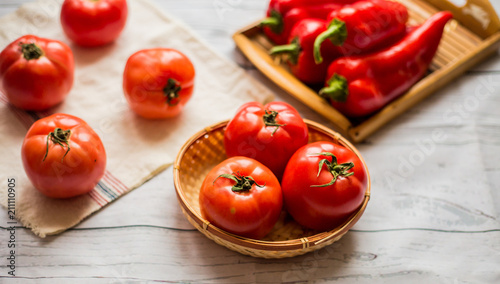 Close-up of fresh, ripe tomatoes on wood background