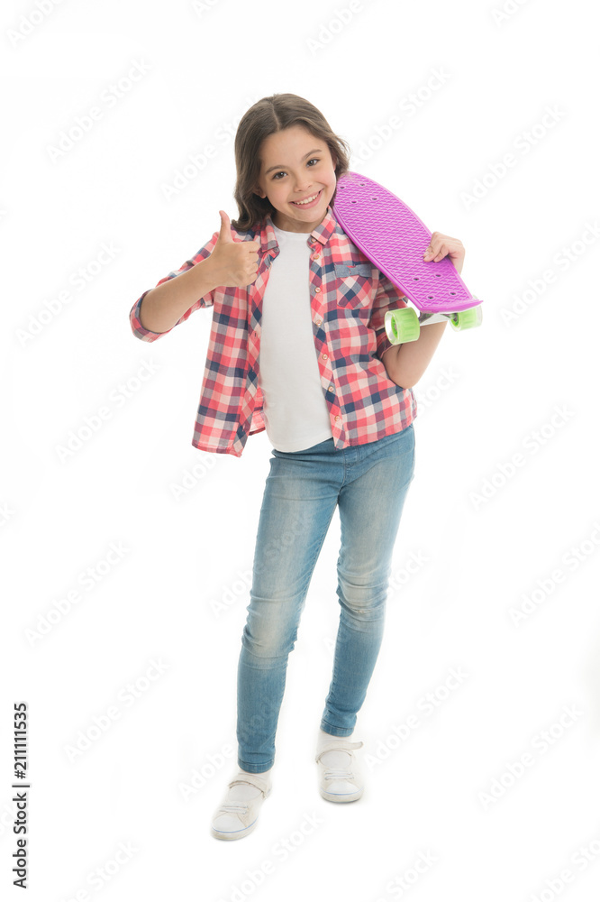 Nice board. Kid girl happy holds penny board. Modern teen hobby. Girl happy face carries penny board white background. Learning how to ride penny board. Child likes plastic skateboard shows thumbs up Nice board. Kid girl happy holds penny board. Modern teen hobby. Girl happy face carries penny board white background. Learning how to ride penny board. Child likes plastic skateboard shows thumbs up