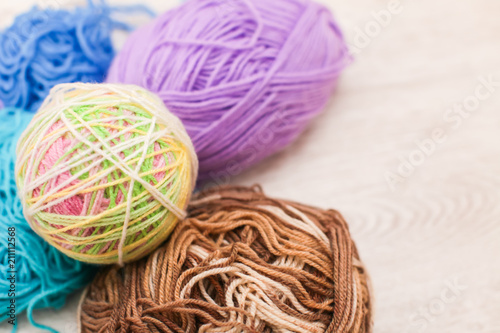 colorful threads for Knitting close up of colorful yarn wool, a lot of balls of yarn with space for text