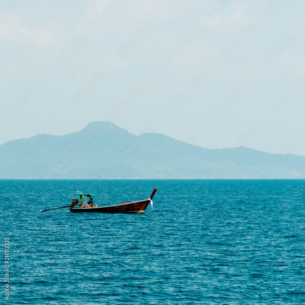 Motor boat and island in the sea Motor boat and island in the sea