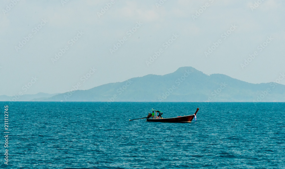 Motor boat and island in the sea Motor boat and island in the sea