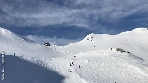 Beautiful winter panorama of a snowy mountains and ski tracks photo