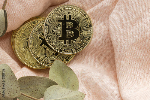 Golden bitcoin on colorful backgrounds photo