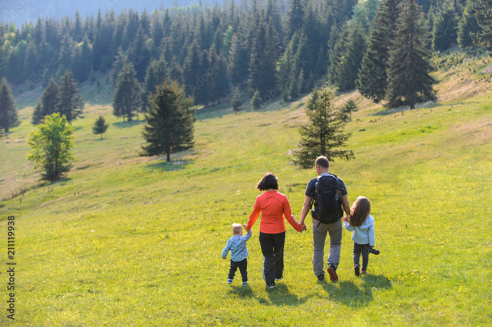 Family Walking on Meadow Family Walking on Meadow