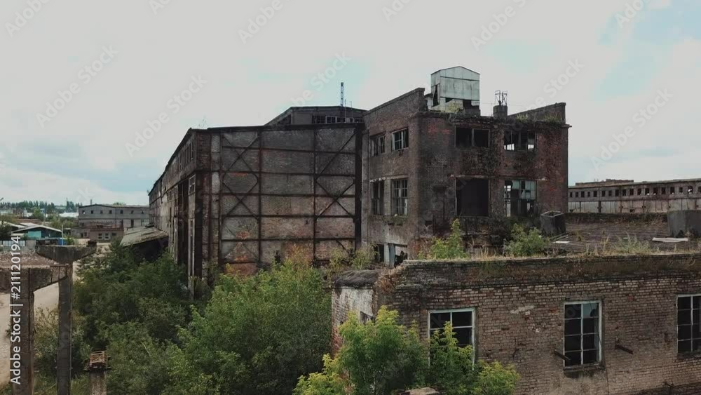 Aerial view from the air to an abandoned factory. Old industrial building for demolition. Aerial view from the air to an abandoned factory. Old industrial building for demolition.