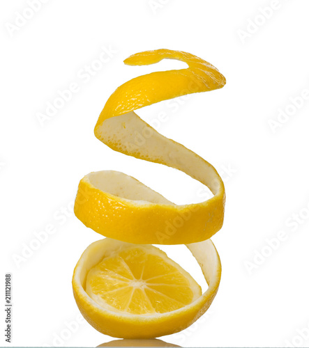 Spiral peel with zest, cutting with lemon, isolated on white