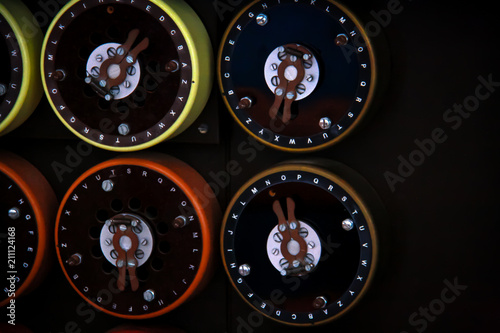 Close up of rotary dials on the front of the British military's Bombe machine, used to decode German Enigma machine encoded messages during world war 2 photo