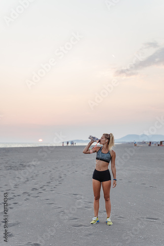 Sportswoman Drinking Water