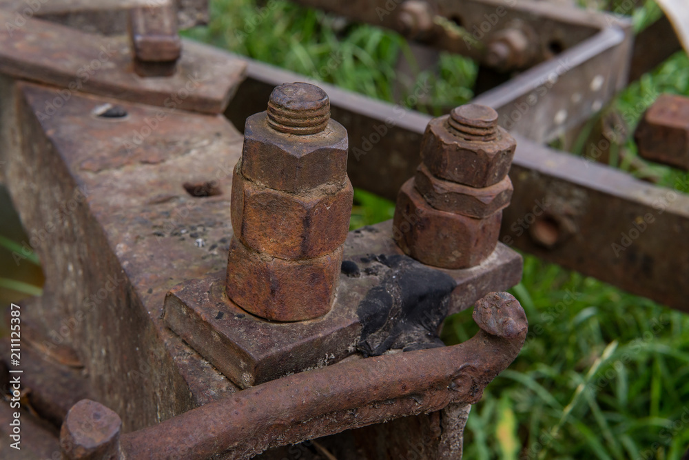 Rusty metal construction with bolts and nuts