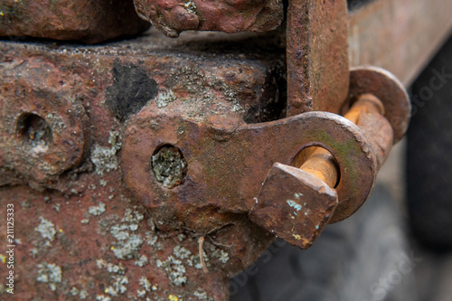 Rusty metal construction with bolts and nuts
