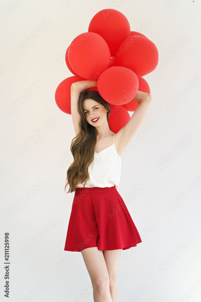 attractive young woman with red balloons on white background attractive young woman with red balloons on white background