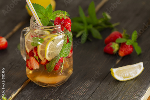 cocktail with fresh fruits, berries and mint