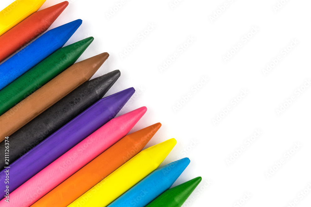 Set of multi-colored wax pencils arranged diagonally close-up isolated on white Set of multi-colored wax pencils arranged diagonally close-up isolated on white