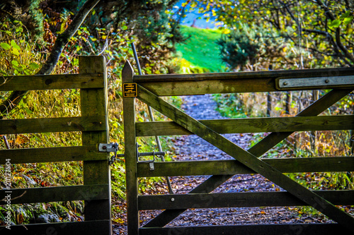 A wooden gate blocks the Scorrybreac circuit walking trail through the traditional Nicolson clan's lands near Portree on the Isle of Skye in Scotland, UK