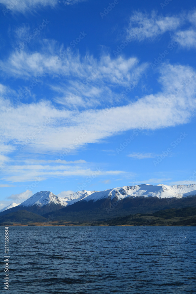 Snow capped mountain range view from the cruise ship on Beagle channel, Ushuaia, Tierra del Fuego, Argentina 