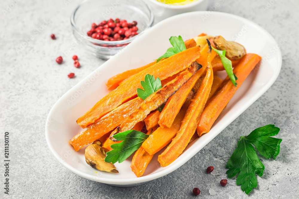 Garlic honey roasted carrots. Selective focus, space for text. Garlic honey roasted carrots. Selective focus, space for text.