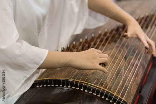 Playing the zither's moment photo